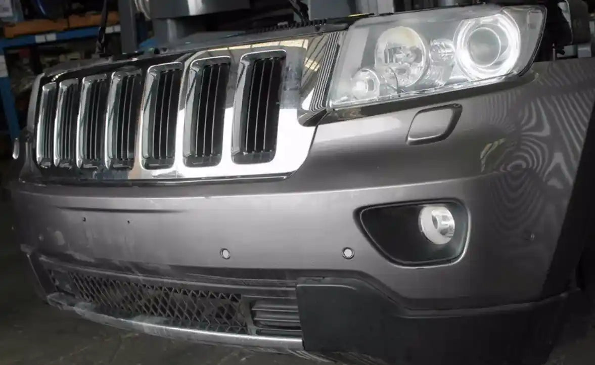 Used Jeep, Grand Cherokee Left Headlamp Wk Laredo/Limited/Overland Xenon Type Chrome Bezel 10/10 03/13 2012 – image 1 - All Good Parts