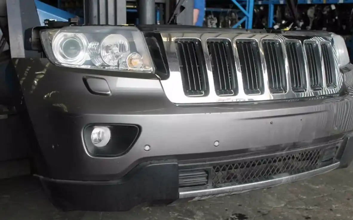 Used Jeep, Grand Cherokee Right Headlamp Wk Laredo/Limited/Overland Xenon Type Chrome Bezel 10/10 03/13 2012 – image 1 - All Good Parts