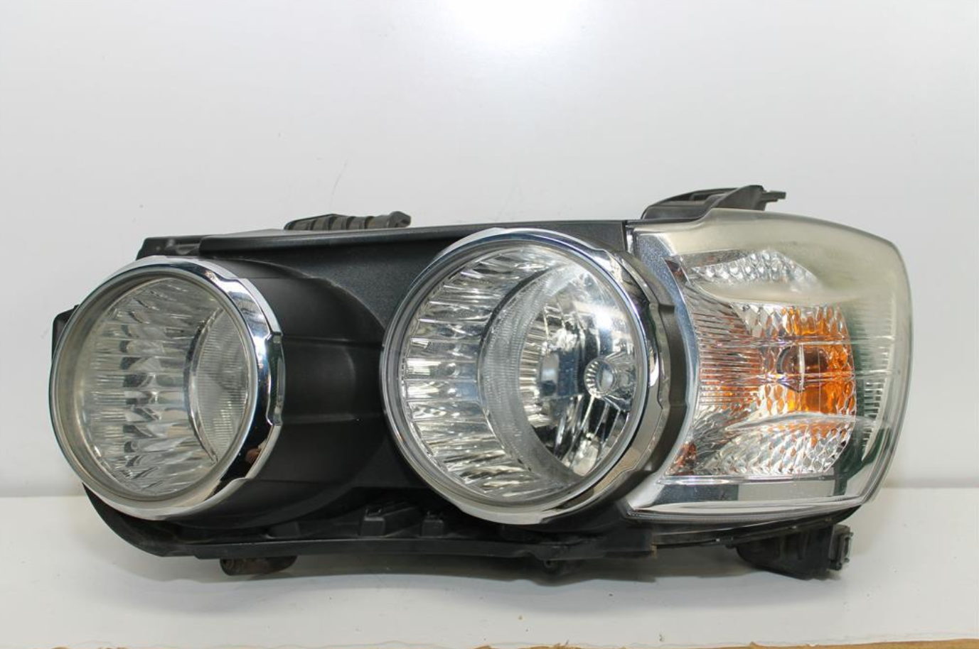 Used Holden, Barina Left Headlamp Tm W/ Chrome Ring Type 09/11 08/16 2012 – image 1 - All Good Parts