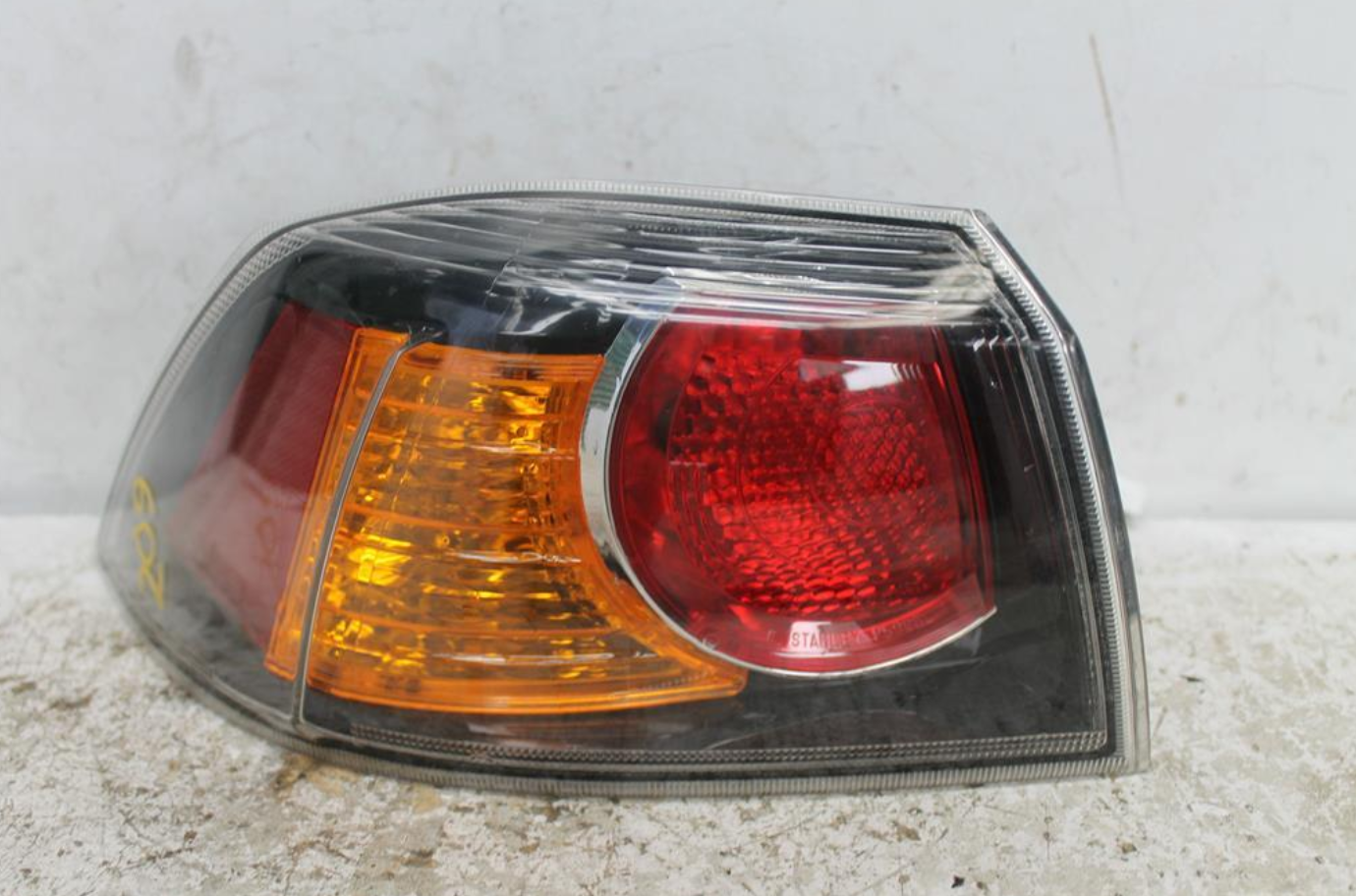 Used Mitsubishi, Lancer Left Taillight Cj Cf Sedan Black Insert Type 07/07 12/17 2013 – image 1 - All Good Parts